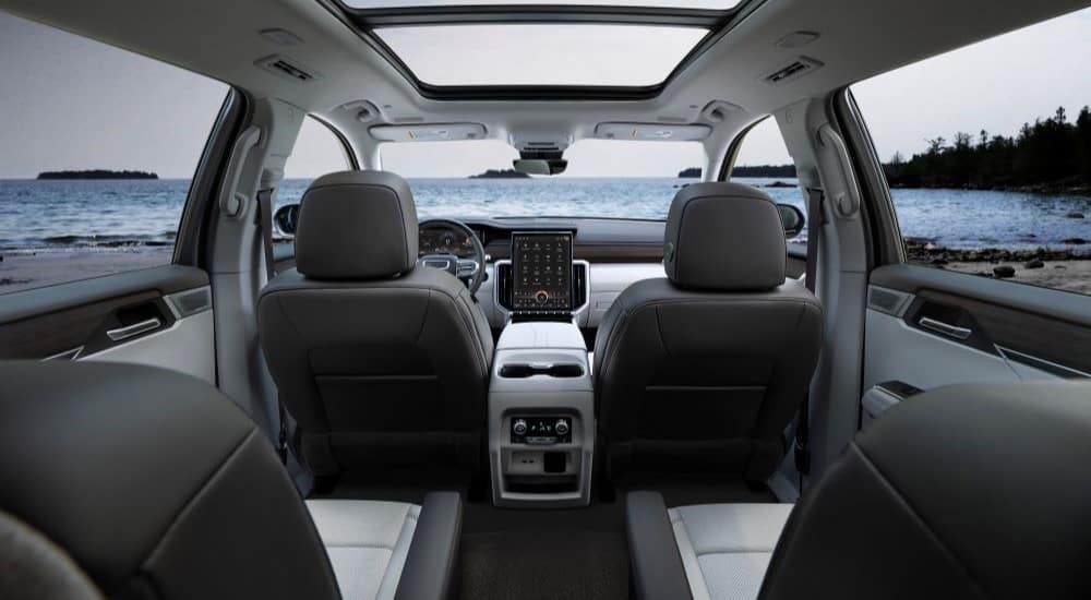 The black and white interior is shown in a 2024 GMC Acadia Denali.
