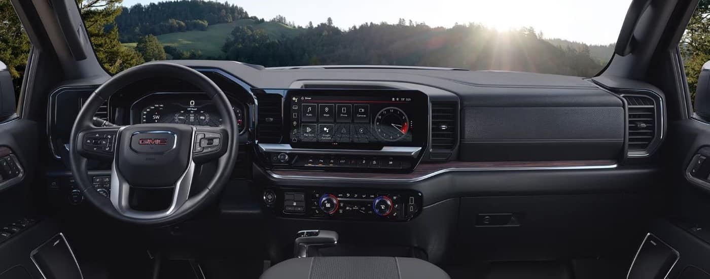The black dash and interior is shown in a 2024 GMC Sierra 1500.